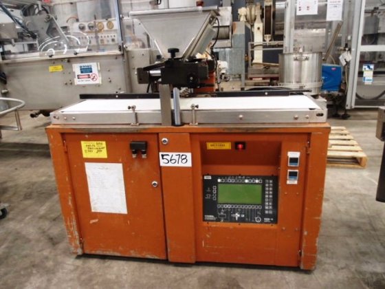 Food-processing depositor with hopper and conveyor for precise portioning at scale.