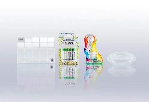 Assortment of transparent fibre packaged products by Chocal including chocolate and non-food items.