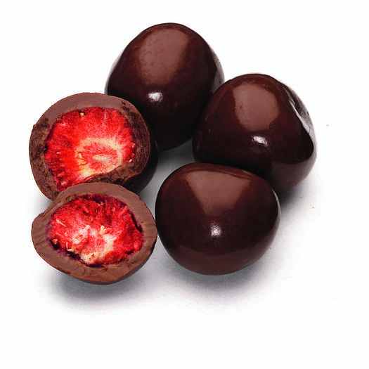 Four strawberries coated in shiny milk chocolate. One is broken, showing the inside.