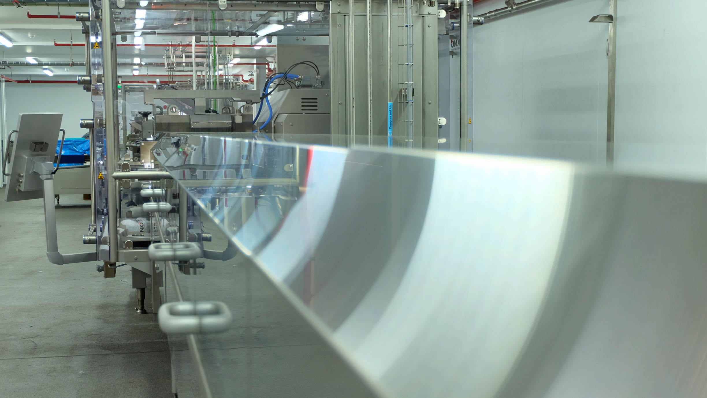 Cooling tunnel inside a food processing factory.