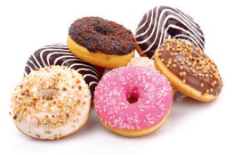 Seven doughnuts coated in icing or chocolate and decorated with sprinkles and toppings.