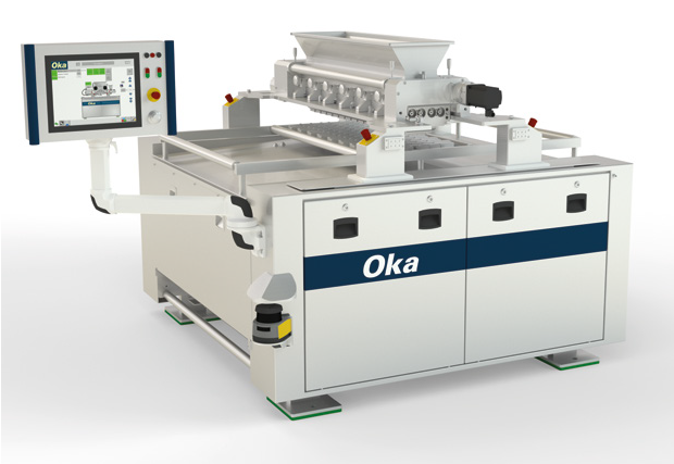 Industrial depositor machine with 'Oka' branding.