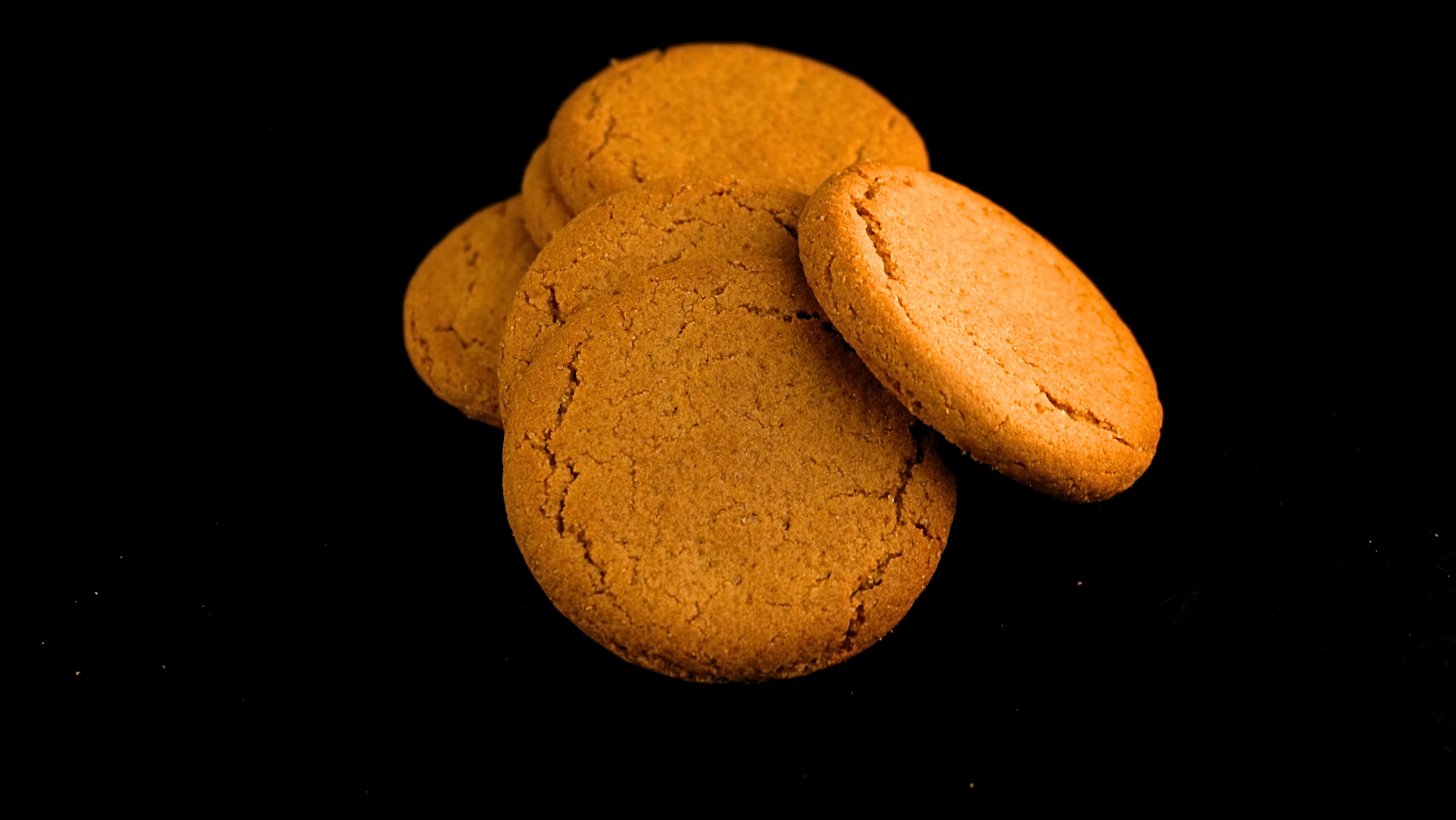 Close-up of six ginger biscuits.