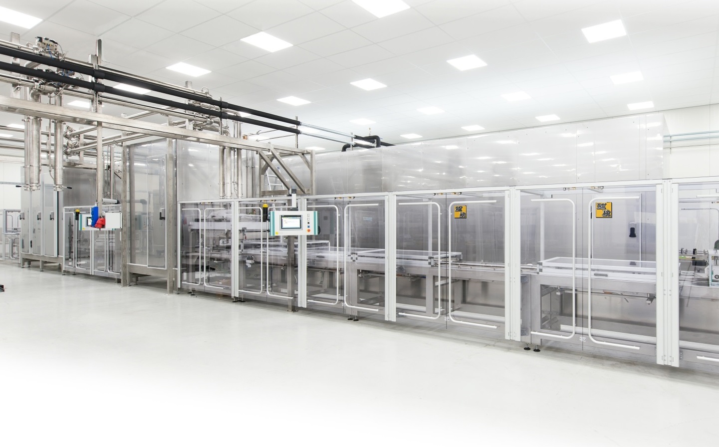 Image of an industrial moulding line in factory setting.