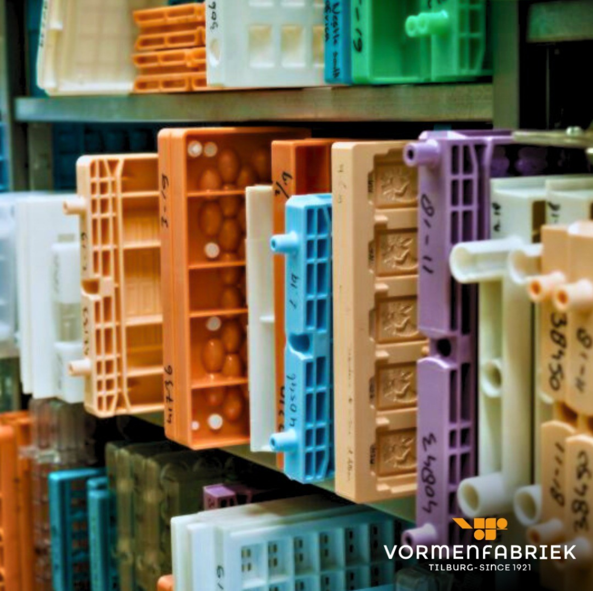 A close-up of Vormenfabriek moulds lined up on a shelf.