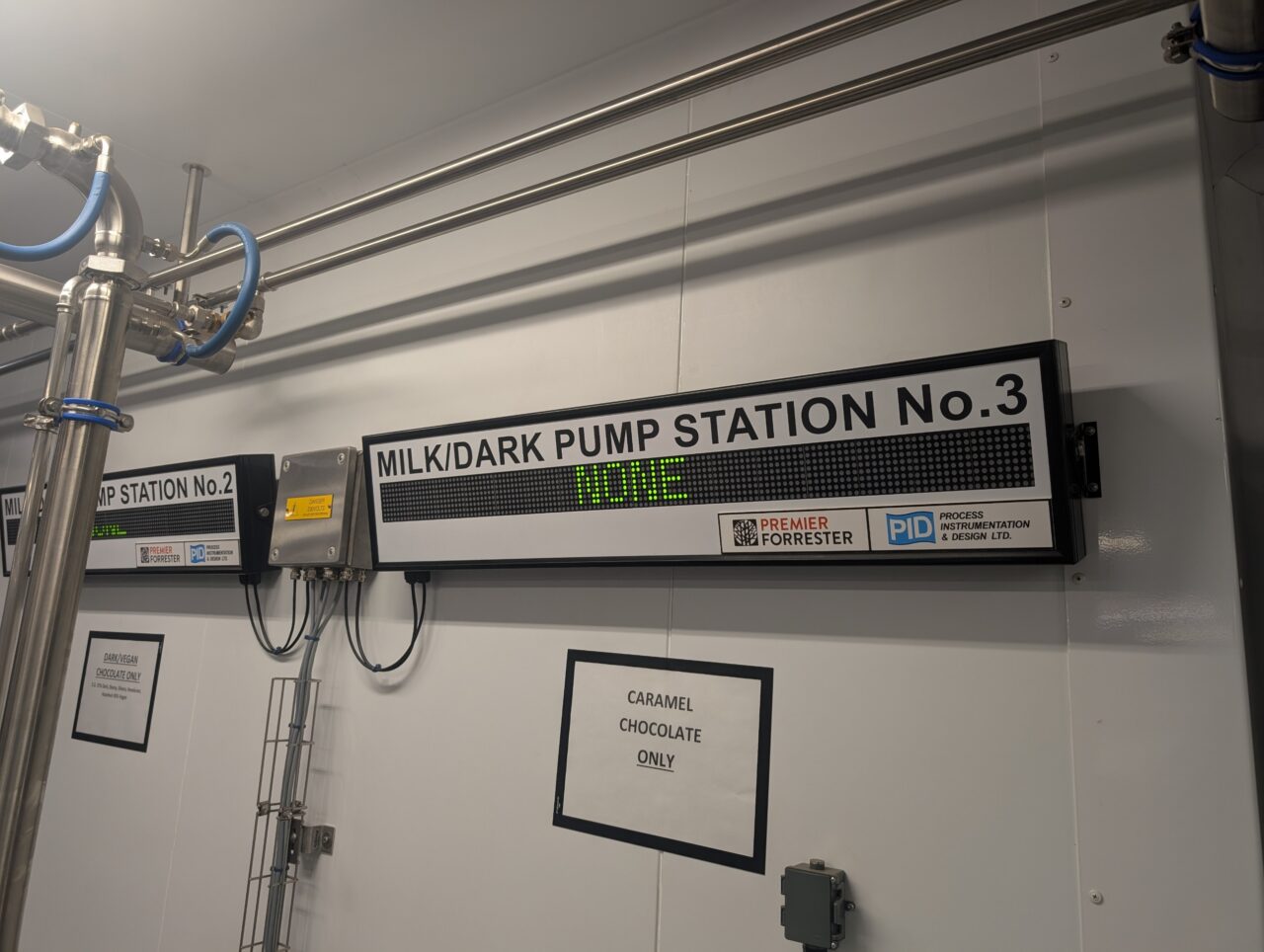 Close up of 'milk/dark pump station No.3' sign. 