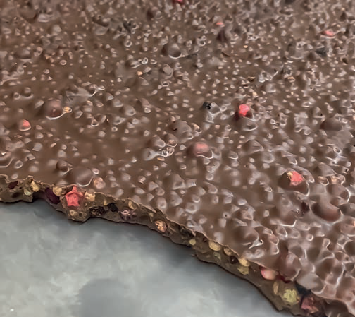 Chocolate slab with fruit and nut inclusions. 