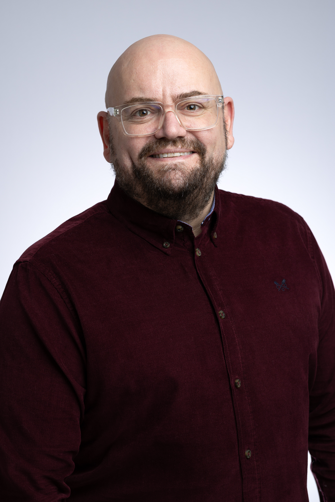 Headshot of Mike Gee against white backdrop.
