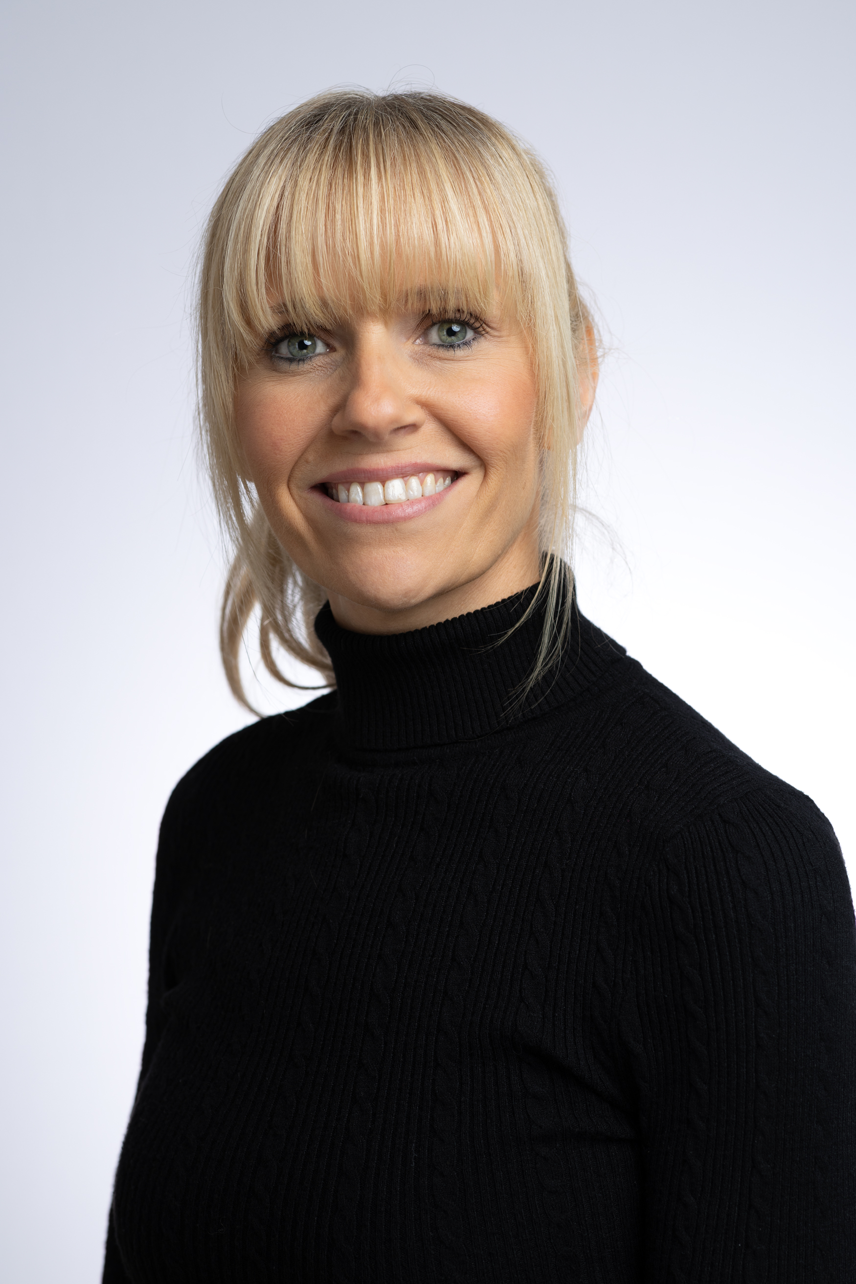 Headshot of Caroline Major against white backdrop.