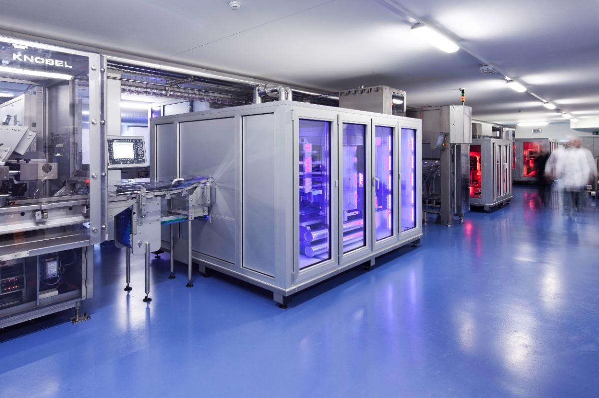 Image of a spiral cooling unit in a factory setting.