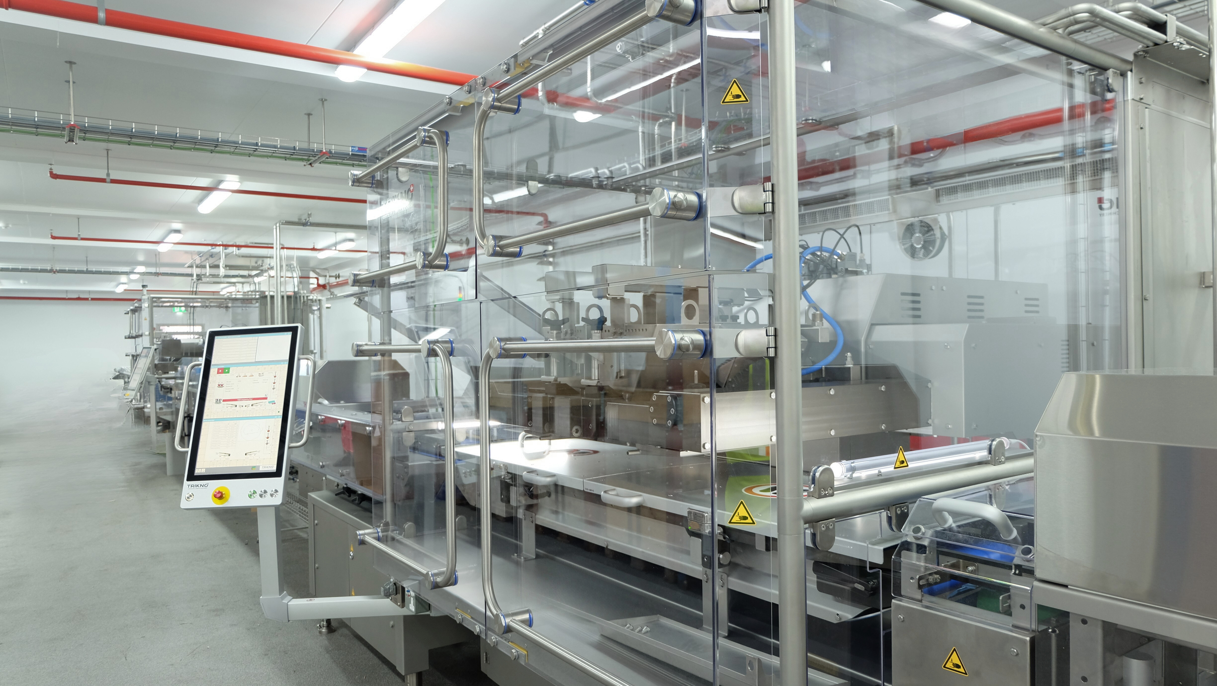 Wide image of Trikno CAD Depositor machine.