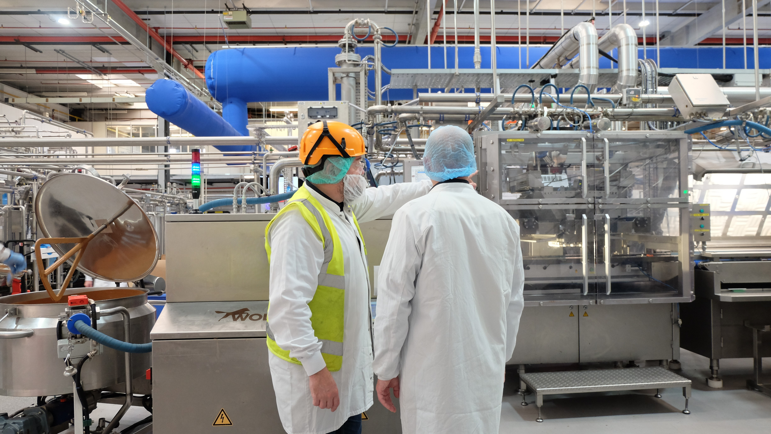 Mike Gee standing by UF750 WOLF Tempering Unit.