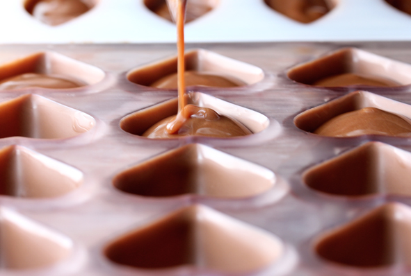 A close-up of a heart-shaped Vormenfabriek Tilburg chocolate mould.