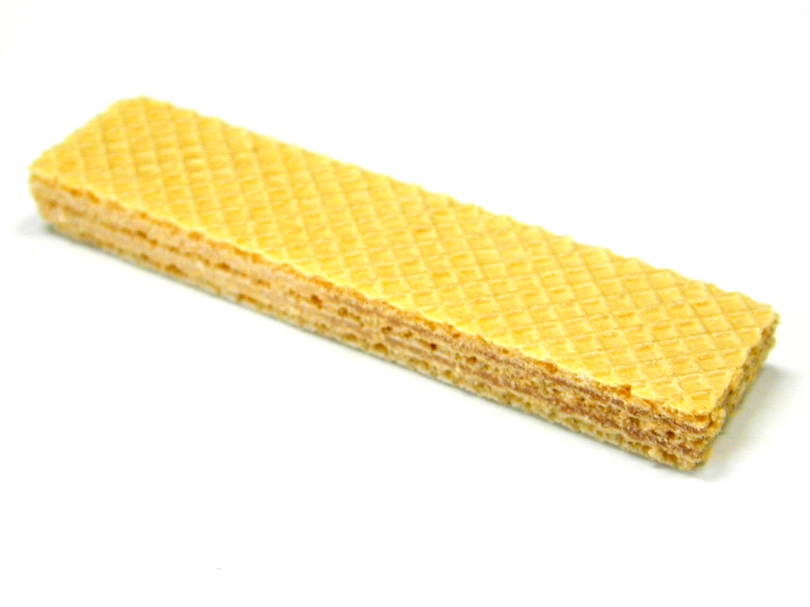 A close-up of a wafer biscuit on a white surface.